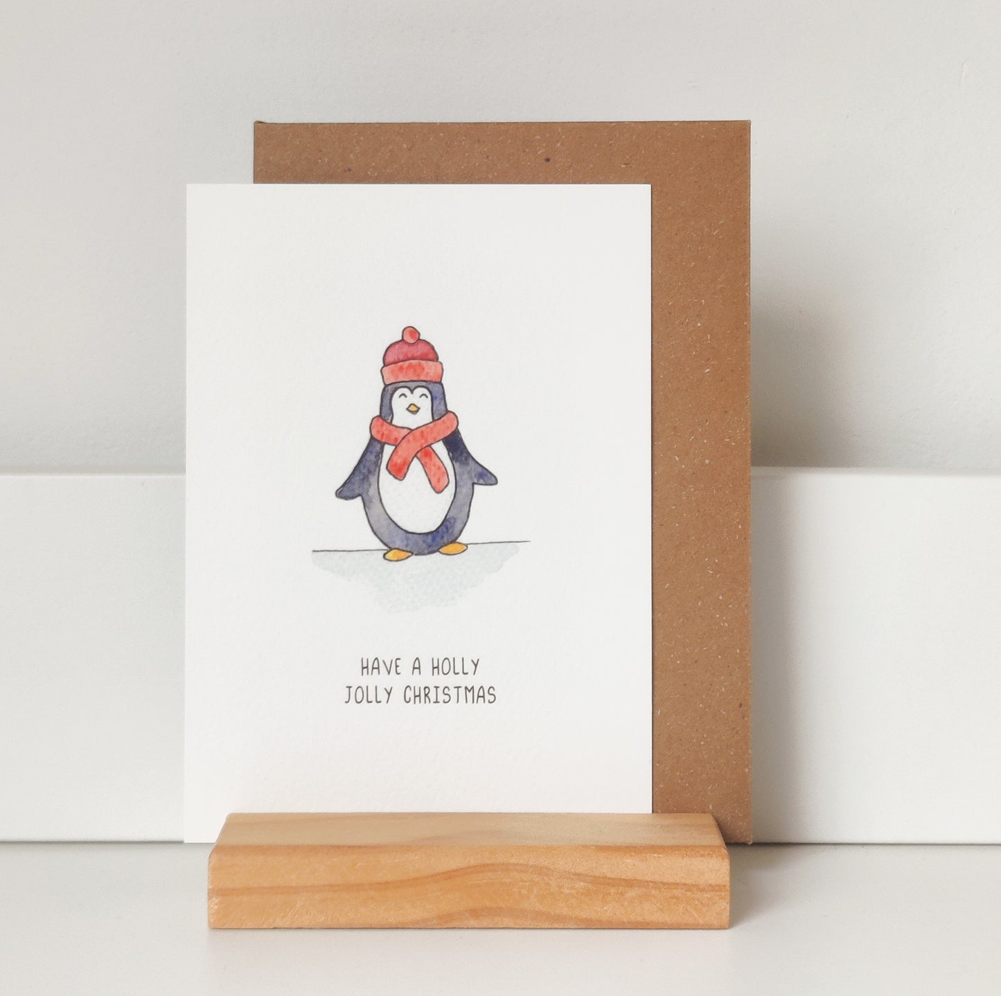 Kerstkaart pinguin muts en sjaal