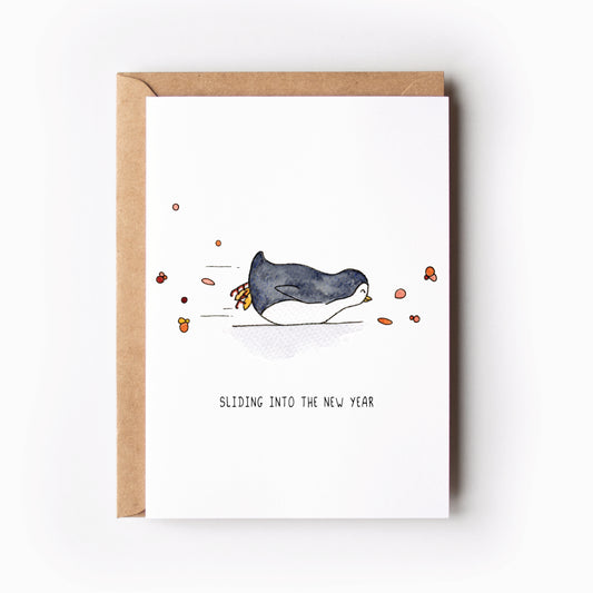 Kerstkaart glijdende pinguin